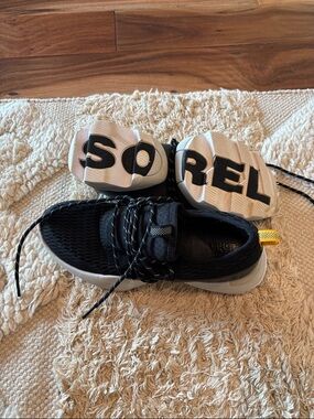 Sorel Black Knit Athletic Sneaker with White Sole and Yellow Pull Tab